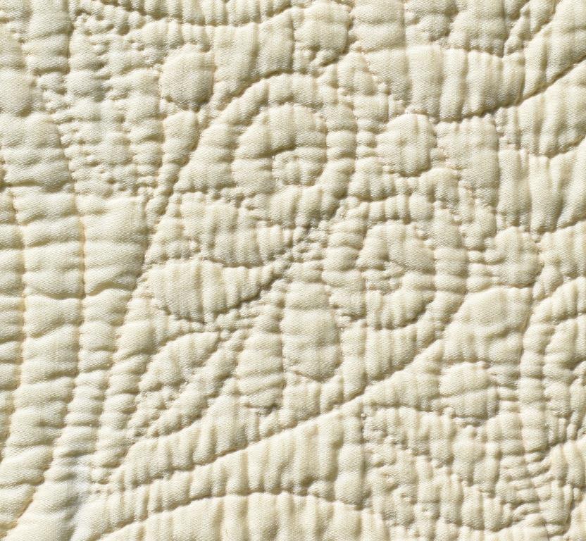 Quilted heart motif on cream cloth